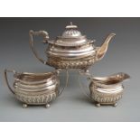 George V Walker and Hall hallmarked silver three piece teaset with reeded lower body and raised on