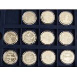 History of the R.A.F silver £5 and $5 coin collection comprising 11 silver crown sized coins in a