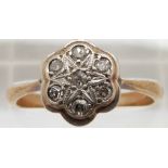 A 9ct gold ring set with diamonds in a platinum setting, 2.8g, size R
