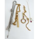 A collection of costume jewellery including purple pearl necklace, 9ct gold chain, ceramic bead