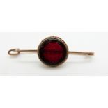 A yellow metal brooch set with an intaglio seal cabochon, 4.1g, 5cm