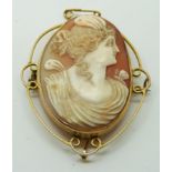 Victorian yellow metal brooch set with a cameo depicting a lady, 4 x 4.8cm