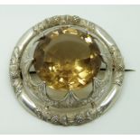 Victorian silver brooch/plaid set with a large citrine (Caingorm) within a thistle decorated border,