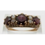 A 9ct gold garnet and pearl ring, 3g, size R