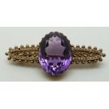 Edwardian 15ct gold brooch set with a large oval cut amethyst and seed pearls, 4.7g long