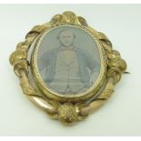 Victorian pinchbeck swivel mourning brooch set with a daguerreotype, verso plaited hair, 5.8 x 5.
