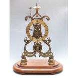 Brass single fusee skeleton clock, passing strike on a bell, raised on an oval mahogany plinth