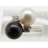 An 18ct white gold ring set with pearls and diamonds, 4.9g, size M
