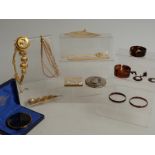 A collection of costume jewellery including Sphinx necklace, Stratton Wedgwood compact, white