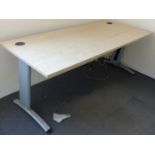 A beech office desk raised on metal legs, 180x80cm.