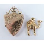 Victorian 9ct gold back and front shield shaped locket and an 18ct gold camel charm, 1.6g
