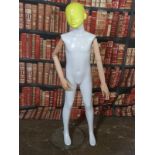 Haberdashery/shopfitting modern articulated child mannequin supported by a removable steel column to