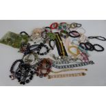 A collection of costume jewellery including pearl bracelet, beads,etc