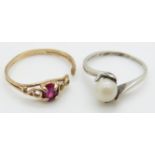 A 9ct gold ring set with a synthetic oval cut ruby and a white metal ring with hands clasping pearl,