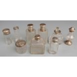 Five hallmarked silver mounted items including dressing table bottles, salt and vase together with