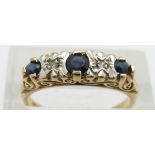 A 9ct gold ring set with three sapphires and diamonds, 2.6g, size O