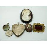 Victorian jet brooch set with a cameo, a silver heart locket, Victorian brooch, cameo brooch etc
