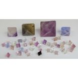 Forty-two rough fluorite gemstones.