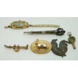 A 9ct gold Victorian brooch in the form of a crop and horseshoe, silver brooch set with agate,
