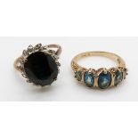 A 9ct gold ring set with a sapphire and diamonds and a 9ct gold ring set with blue topaz, 6.8g