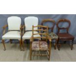 Two cream upholstered armchairs and three various further chairs