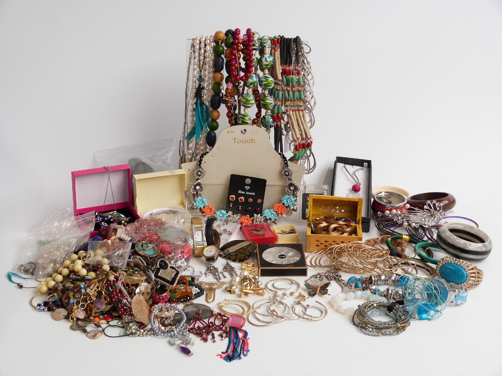 A collection of costume jewellery including quartz bracelet, necklaces, etc