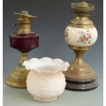 Two 19thC /20thC oil lamps, one with cranberry glass bowl
