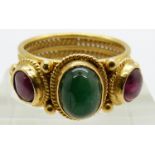 Ilias Lalaounis 18ct gold ring set with an emerald cabochon and two ruby cabochons, originally
