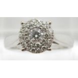 An 18ct white gold ring set with a cluster of diamonds, total 0.5ct, 4.8g, size P