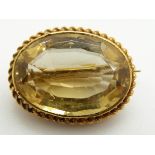 Victorian brooch set with an oval cut citrine within a rope twist border, 4.4g, 2.2 x 1.6cm