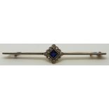 Art Deco brooch set with a square cut sapphire surrounded by diamonds, 6.2cm long