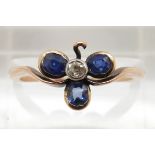 Victorian ring set with three oval sapphires and a diamond in a clover setting, 2.1g, size N