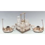 Silver plated four bottle cruet and two chamber sticks