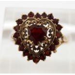 A 9ct gold ring set with garnets in a heart shape, 2.7g, size P