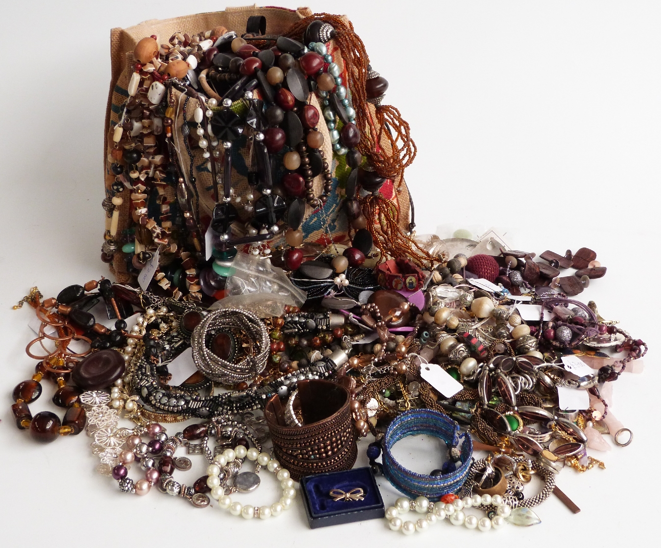 A collection of costume jewellery including brooches, Hollywood brooch, beads, necklaces, silver