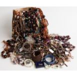 A collection of costume jewellery including brooches, Hollywood brooch, beads, necklaces, silver