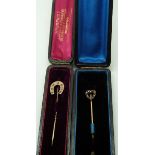 A horseshoe stick pin set with diamonds and rubies in original box and a Victorian heart shaped