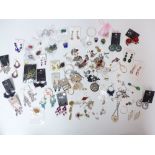 A collection of costume jewellery earrings and silver earrings
