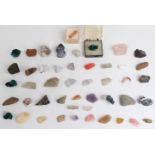 Forty-seven various rough gemstones including rose quartz, amethyst etc.