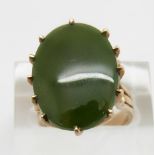 A 9ct gold ring set with a jade style plaque, size K