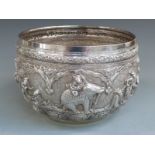 A 19thC Indian / Burmese white metal bowl with relief moulded figural frieze decoration of