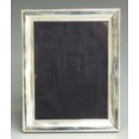 Modern hallmarked silver photograph frame to suit 8x6 inch photo, with blue velvet easel back,