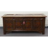 Antique oak carved and panelled coffer with peg joints, W166 x D65 x H68cm