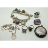 A silver brooch set with amethyst, silver charm bracelet, miniature lighter marked Pygmy Japan,