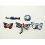 A group of enamel brooches including silver example by JA & S, two butterfly examples, a dragonfly