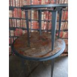 Industrial/haberdashery/shopfitting two circular steel tables, one inset with parquet tiles, largest