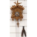 Black Forest mid 20thC cuckoo clock with carved decoration in the form of two squirrels, 30cm tall