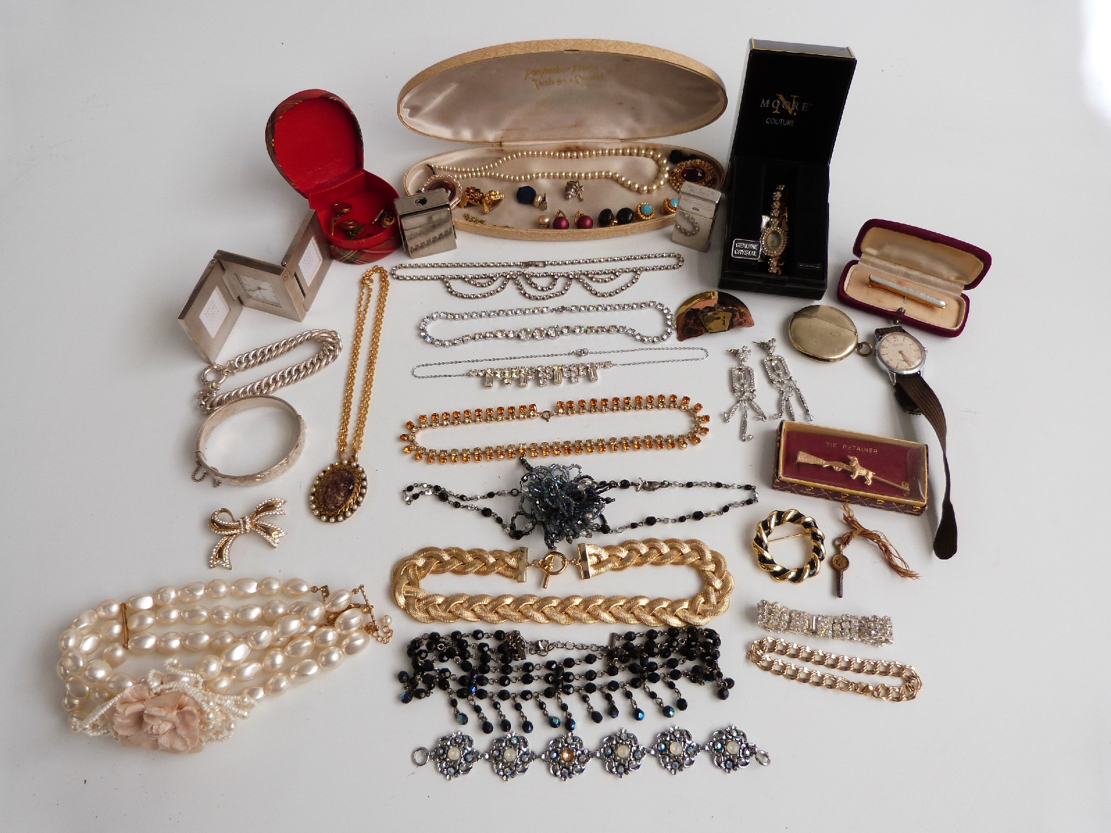 A collection of costume jewellery including silver bracelet, silver bangle, Ingersoll watch, paste