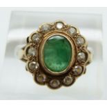 A 9ct gold ring set with an emerald and cubic zirconia, 3.2g, size O