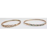 A 9ct gold bangle with a Celtic design and a 9ct gold bangle set with emeralds and diamonds, 9.2g
